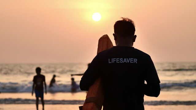 beach lifeguard keeps order in the ocean