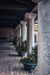 Arcade passageway of an old farm house photo. Small village in Catalonia photography.