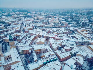 white snowy winter over European old town Lublin, snow storm and snowfall at ancient district of Poland, Europe aerial © goami