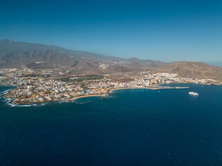 Obraz premium ocean shore with hotels and beach, Los Cristianos, Tenerife, Canary, aerial shot
