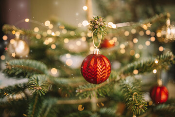Close up of xmas balls on Christmas tree. Bokeh garlands in the background. New Year concept. High quality photo
