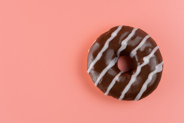Sweet chocolate donut on bright background. Top view.