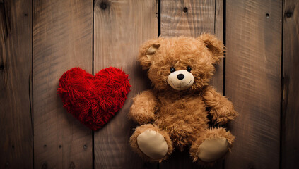 Teddy bear with red heart on the wall