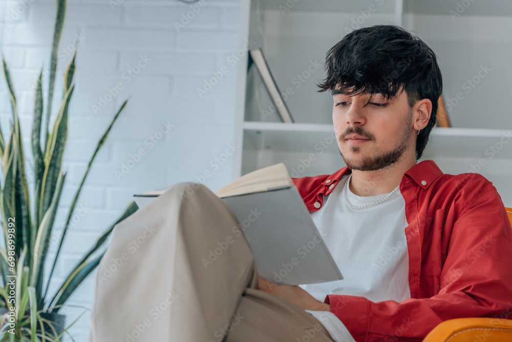 Poster young man reading a textbook