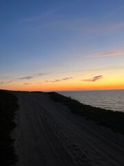 Ocean and purple sky at the ocean bay, orange ocean horizon