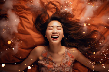 Young Asian woman having orgasm. Beautiful woman with open mouth and closed eyes enjoying sex lying among fireworks. Sparklers as a symbol of orgasm. Sexual experience, masturbation, cunnilingus. - obrazy, fototapety, plakaty