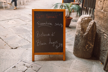Traditional sicilian restaurant chalkboard. Handwritten Italian restaurant with menu chalkboard. High quality photo