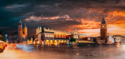 Krakow, Poland. Famous Landmarks On Old Town Square In Summer Evening. St. Mary's Basilica, Cloth...