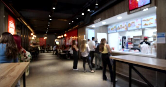 Time Lapse video of People Ordering from the Fast Food restaurant. Blurred background 4K video