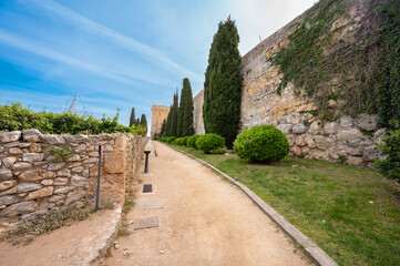 Fototapeta na wymiar A view of Archaeological Walk, with monumental roman walls, in Tarragona, Spain. High quality photography