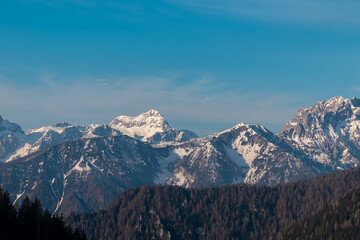 Panoramic view of snow covered mountain range Julian Alps seen from the Karawanks in Carinthia, Austria. Looking at mountain peak Triglav. Tranquil scene in alpine landscape in Slovenian Austrian Alps