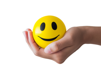 Hand holding a smiley face stress ball, isolated on transparent background, png, - concept for happiness, positivity, and mental health.
