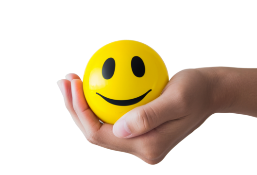 Hand holding a smiley face stress ball, isolated on transparent background, png, - concept for happiness, positivity, and mental health.
