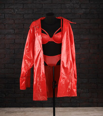 red latex fetish clothes on a hanger