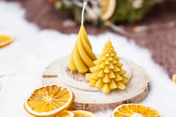 Beeswax candles on light background