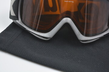 Sports equipment, sports mask for skiing and snowboarding placed on a white background.