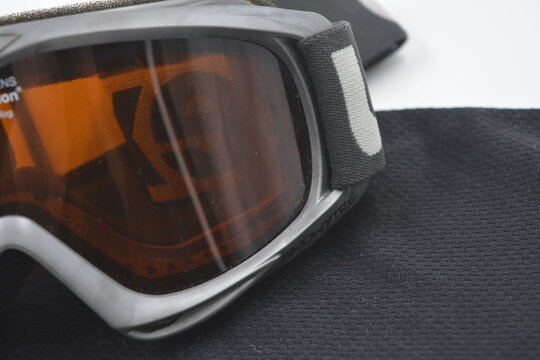 Sports equipment, sports mask for skiing and snowboarding placed on a white background.