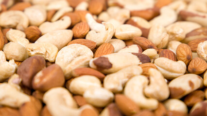 Background of nuts, almonds, cashews, Brazil nuts. Selective focus.