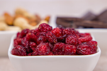 Close-up of dried cranberries in a bowl. Selective focus.
