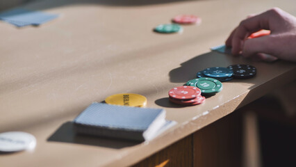 Young guys playing poker at a table.