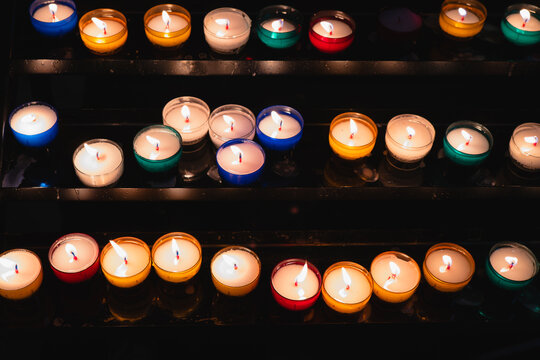 Illuminated votive candles in Bayonne church
