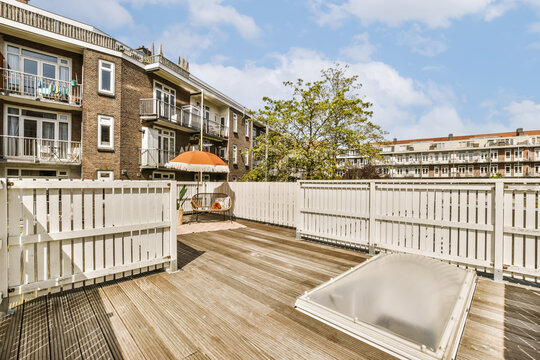 Terrace deck with hot tub and white fence