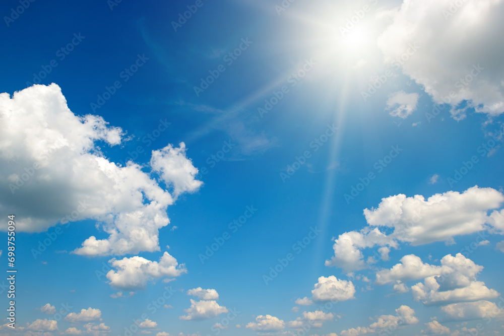 Wall mural bright sun on beautiful blue sky with white clouds. - Wall murals