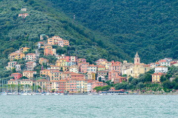 Fototapeta na wymiar La Spezia, Italy, July 30, 2023. View of the village of Cadimare from the sea.