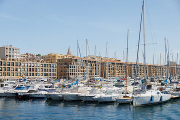 Fototapeta na wymiar Houses on the waterfront of Marseille, view from the marina side.
