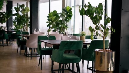 luxury restaurant interior with glass glasses on tables hospitality and service concept