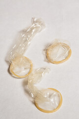 Condom on a white background, contraception