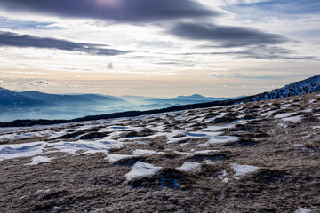 Scenic hiking trail over snow covered alpine meadow between Gertrusk and Ladinger Spitz, Saualpe,...