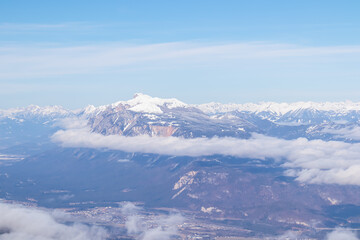 Panoramic view of snow capped mountain peak of Dobratsch in Karawanks, Carinthia, Austria. Winter wonderland in Austrian Alps. Snowshoe hiking through forest and snowy landscape. Villach surroundings