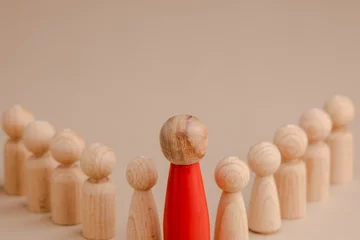 Foto op Canvas wooden figure representing a leader leading other figures. Leadership concept  © photo for everything