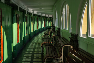 Turquoise hallway with benches