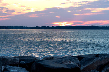 Sun rising above the water along the Chesapeake Bay in Yorktown, Virginia. 