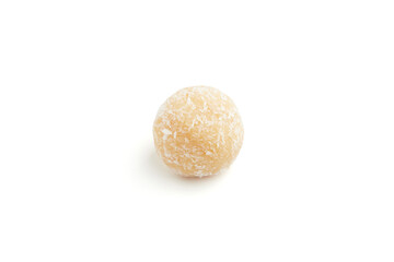Typical Brazilian sweet brigadeiro. One coconut candy on a white background