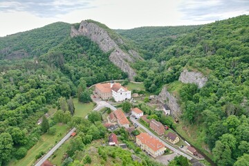 Fototapeta na wymiar Aerial view of Svaty Jan pod Skalou monastery and village,Bohemia, Czech Republic,Europe