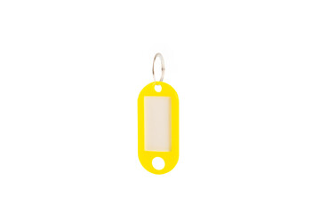 Plastic keychain of different colors with a place for a signature isolated on a white background....