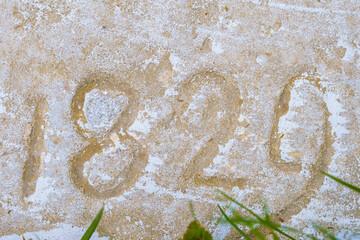 The numbers 1829 on the stone. Background with selective focus and copy space