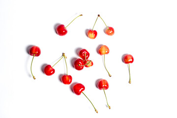 Red ripe cherry on a white background, red berry