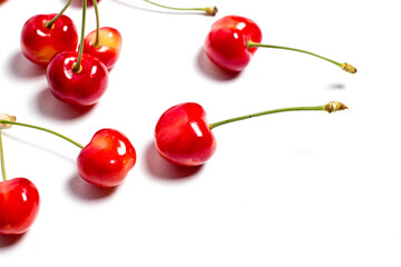 Red ripe cherry on a white background, red berry