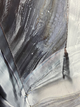 Abstract fluid art in grey, beige, and black with subtle gold accents. Alcohol ink, organic swirls, marbling effect. No real property or natural materials depicted.