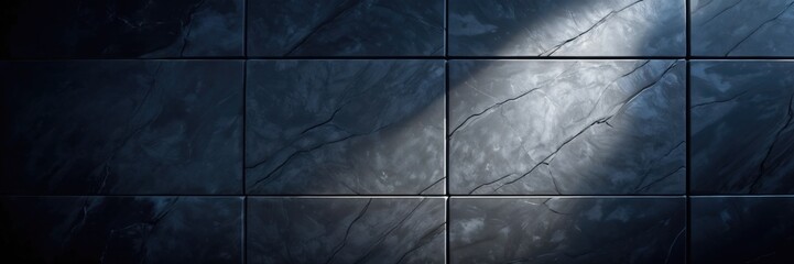 incident ray of light on a black tile wall with rocky stony texture