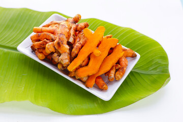 Turmeric roots on banana leaf