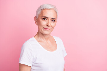 Photo portrait of attractive pensioner woman look camera promo dressed stylish white clothes isolated on pink color background