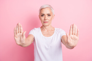 Photo portrait of attractive pensioner woman hands keep distance gesture dressed stylish white...