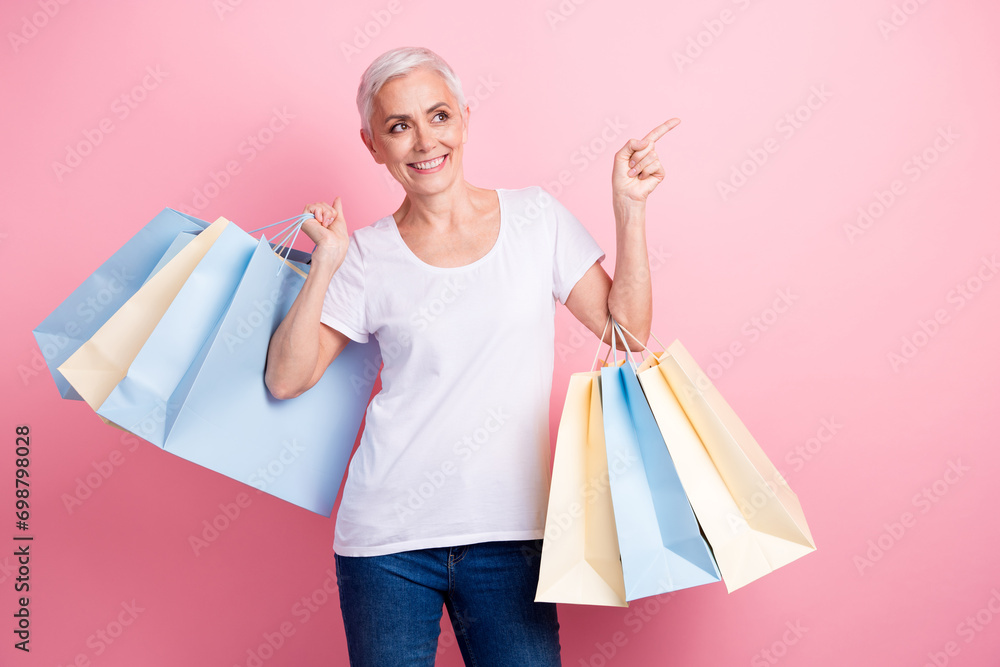 Sticker photo of nice woman with short hair wear white t-shirt hold new outfit look indicating at offer empt