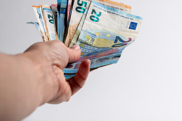 hand holding euro banknotes