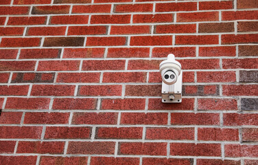 Security camera overlooking urban street, surveillance technology, safety monitoring, privacy, urban security
